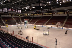 The conversion of Agganis Arena from an ice hockey rink to a concert venue involves removing the Plexiglas from the rink and covering the ice with a "subfloor," an inch-thick layer of flooring. PHOTO BY GRACE BOWDEN/DAILY FREE PRESS STAFF