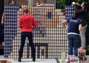 The team from Nitsch Engineering assembles their mural of Grumpy Cat out of canned food for Canstruction Boston at the Boston Society of Architects Space on Saturday. PHOTO BY SONIA RAO/DAILY FREE PRESS CONTRIBUTOR