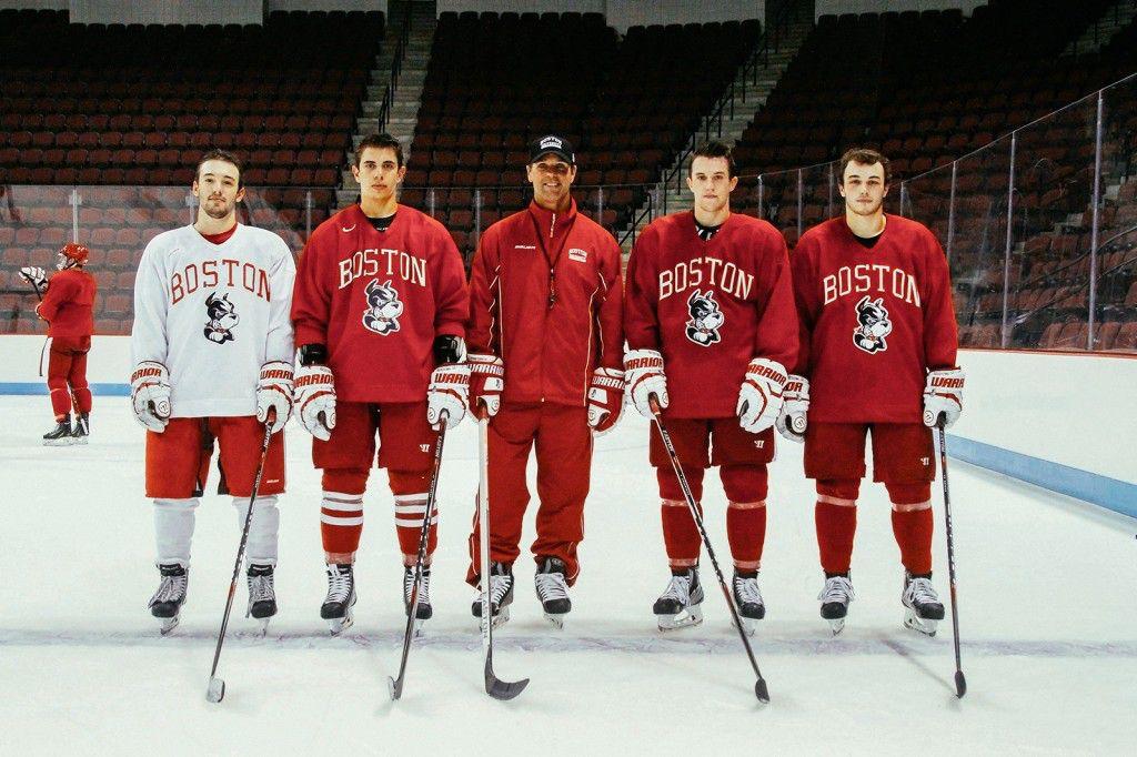 From left to right: Senior forward Cason Hohmann, senior forward Evan Rodrigues, head coach David Quinn, junior captain Matt Grzelcyk, junior forward Danny O'Regan PHOTO BY MAYA DEVEREAUX/DAILY FREE PRESS STAFF