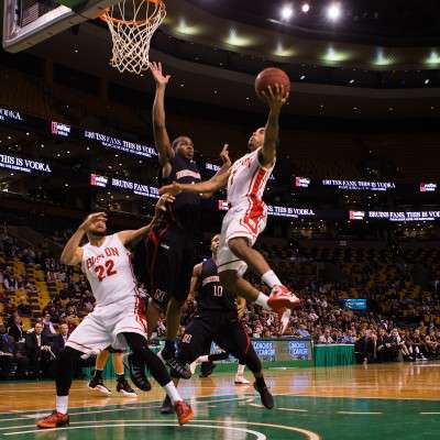 The Boston University men's basketball team, pictured playing against Northeastern University in October 2013, will play in the Coaches vs. Cancer Tripleheader to benefit the American Cancer Society at the TD Garden Sunday. PHOTO BY KENSHIN OKUBO/DFP FILE PHOTO