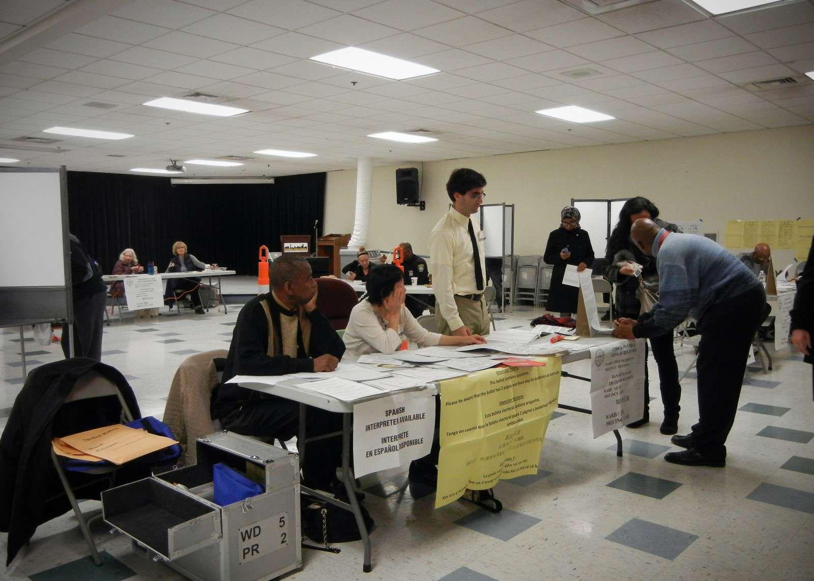Bostonians vote at the Fenway High School polling precinct for the Massachusetts general election Tuesday. PHOTO BY WILLA RUSOWICZ-ORAZEM /DAILY FREE PRESS STAFF