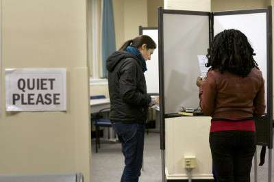 Boston University students vote at the Myles Standish Hall polling precinct for the Massachusetts general election Tuesday. PHOTO BY KYRA LOUIE/DAILY FREE PRESS STAFF