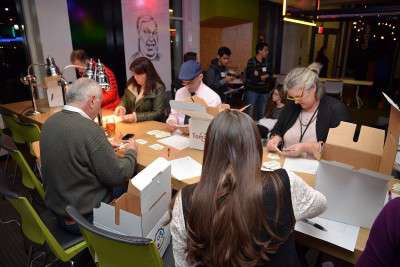 MIT Enterprise Forum committee members and organizers count the money "invested" by participants in each startup at the Beantown Throwdown Tuesday night. PHOTO BY HEATHER GOLDIN/ DAILY FREE PRESS STAFF 