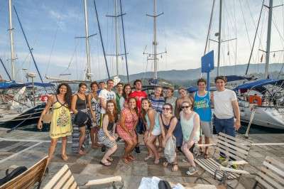 A group of students and professors prepares to embark on a sailing trip to the Greek islands of Aegina and Poros during the 2014 Summer Study in Athens program, organized through the Boston University Philhellenes Project. PHOTO COURTESY OF LOREN SAMONS