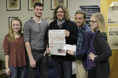 Members of The Daily Free Press Board of Directors, (from left) Sarah Fisher, Tyler Lay, Kyle Plantz and Emily Overholt, pose with Boch (center). PHOTO BY SARAH SILBIGER/DAILY FREE PRESS STAFF