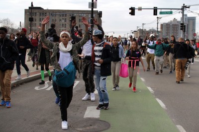 Students of the Boston Arts Academy and Fenway High School were dismissed early Monday to march on Commonwealth Avenue alongside many of their teachers in protest of the grand jury's decision not to indict Officer Darren Wilson in Ferguson, Missouri. PHOTO BY SARAH SILBIGER/DAILY FREE PRESS STAFF