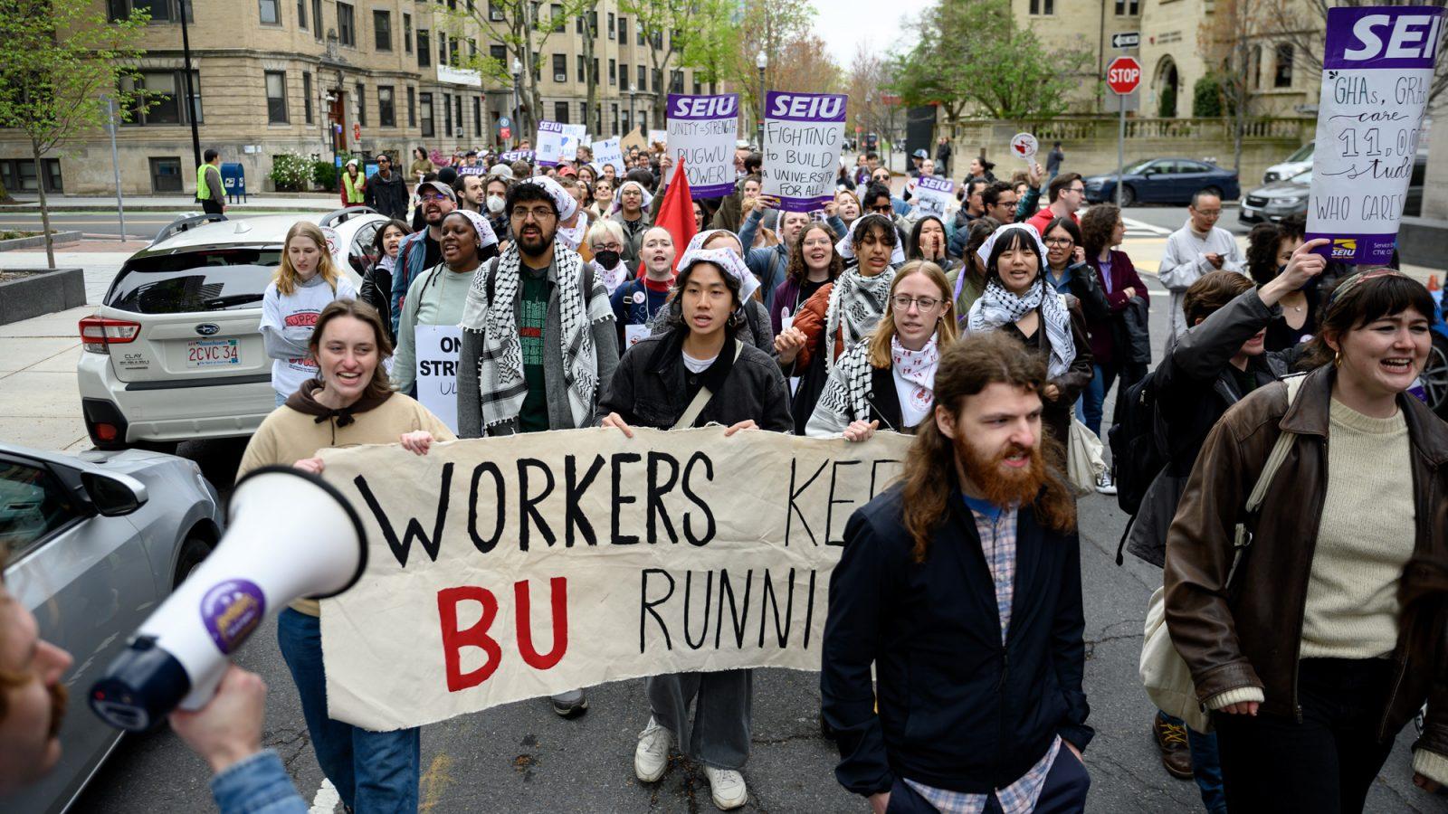 Boston University Graduate Workers Union members and supporters march down Bay State Road toward 1 Silber Way on Wednesday. BUGWU organized a walkout on Wednesday in response to Provost Ken Lutchen’s emails regarding the strike. ANDREW BURKE-STEVENSON/DFP PHOTOGRAPHER