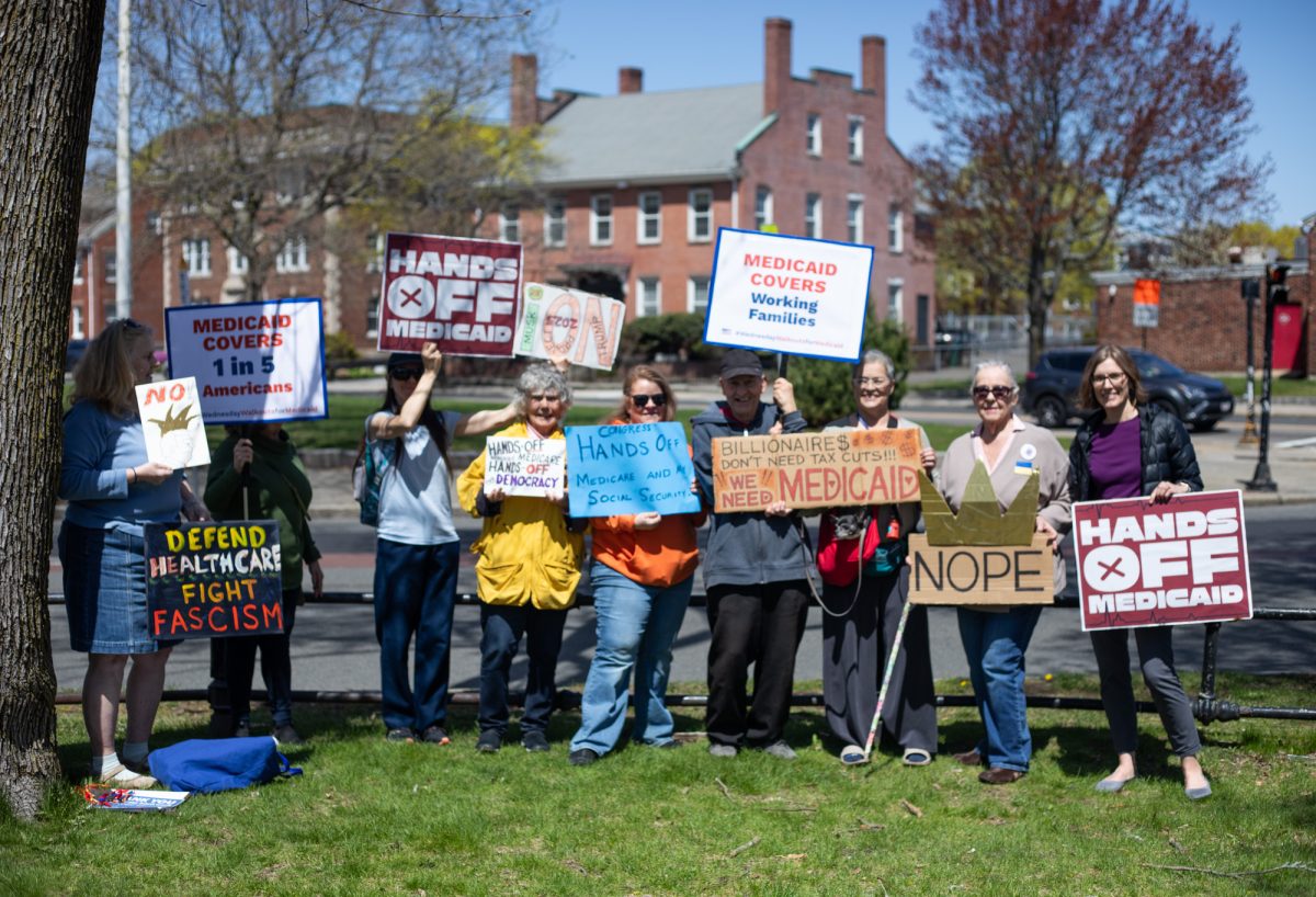 Lynn residents and local workers at Lynn Common Wednesday. They held a walkout to protest the Trump administration’s threat to cut billions of federal funding to Medicaid. 