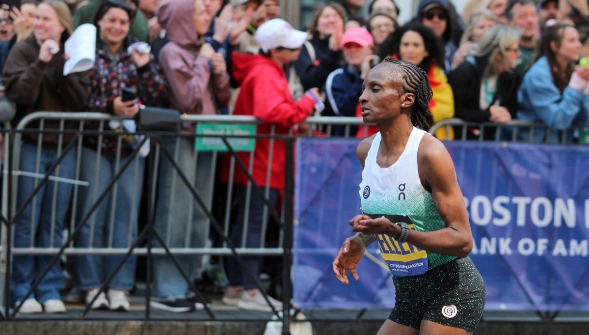 Hellen Obiri runs towards the finish line of the Boston Marathon. 
