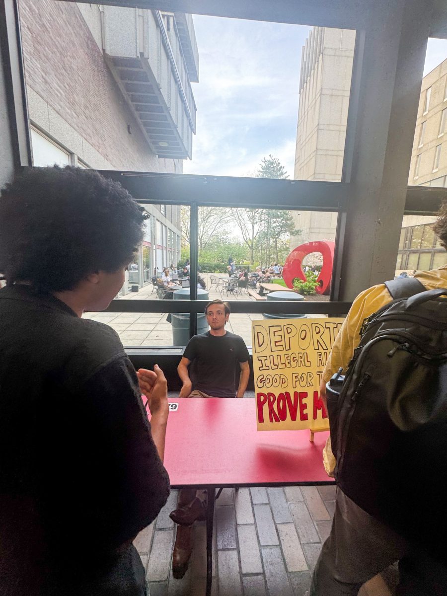 BU Young Americans for Freedom Secretary Colin Sharpe in the George Sherman Union. Sharpe and Alpha Barry, another leader of YAF, invited passersby to debate mass deportations with them in the lobby of the George Sherman Union April 29.