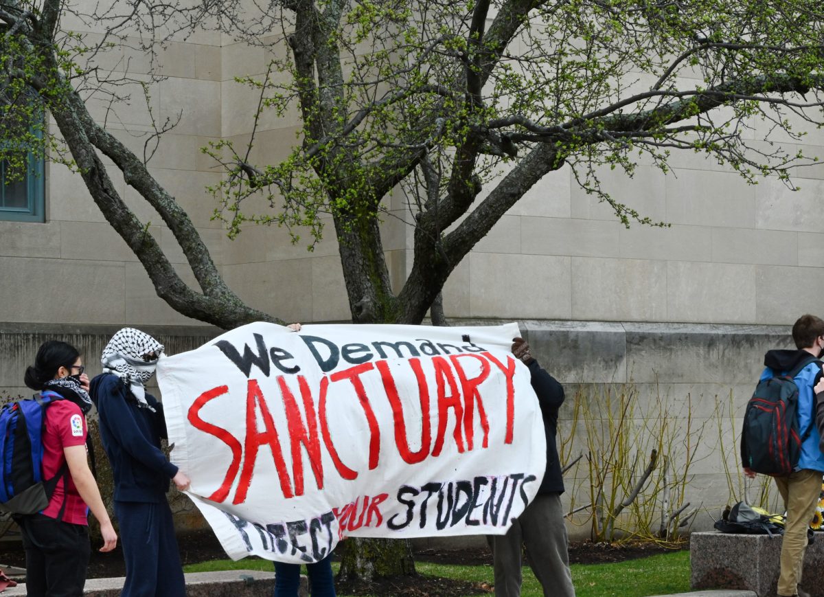Students organize at Marsh Plaza to demand BU declare itself as a sanctuary campus in March. 