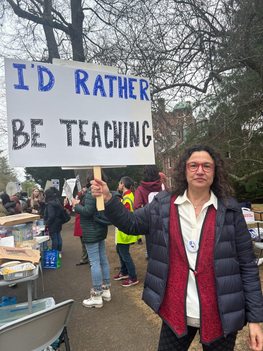 A protestor holds up a sign in support of the Wellesley Organized Academic Workers Union March 31. Wellesley College professors ended a month-long strike April 24 without gaining a union contract, returning to classrooms and lecture halls that suffered under their absence.