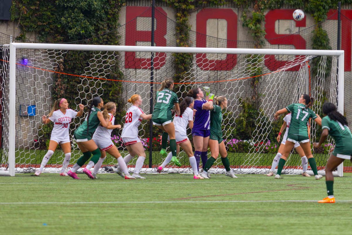 Boston University women’s soccer goalie Bridget Carr prepares to punch the ball away off a corner kick. BU tied 0-0 against Loyola Marymount. 