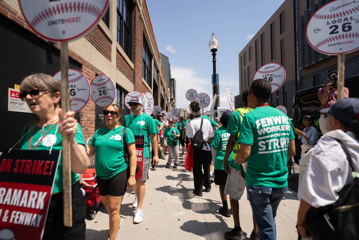 UNITE HERE Local 26 workers picketing at Fenway Park on July 25. During the Boston Red Sox and Los Angeles Dodgers homestand, around 1,000 workers participated in a strike to demand fair wages and limits to automation.