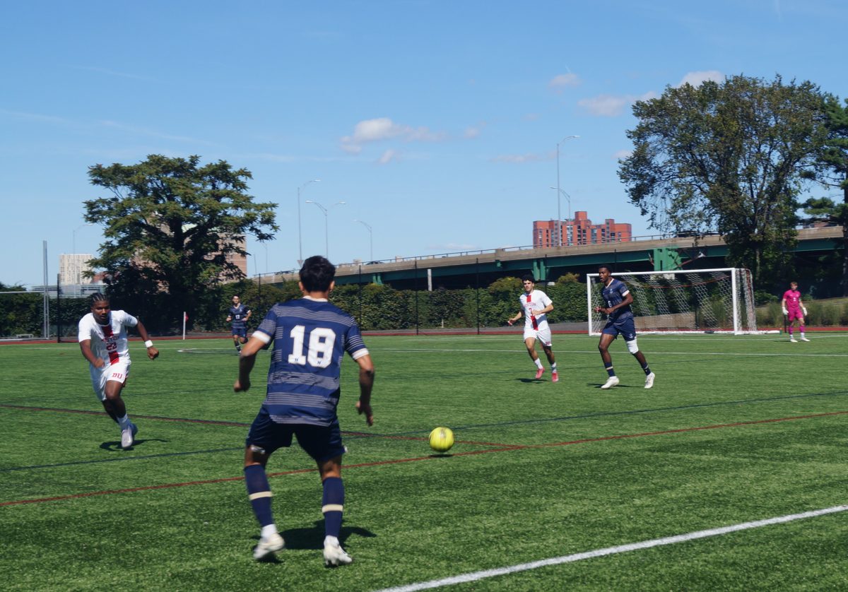 Junior Andrea Di Blasio, number 7, and sophomore Dylan Williams, number 22, in a scuffle. The Boston University Men’s Soccer Team beat Navy 1-0 on Nickerson Field Saturday.