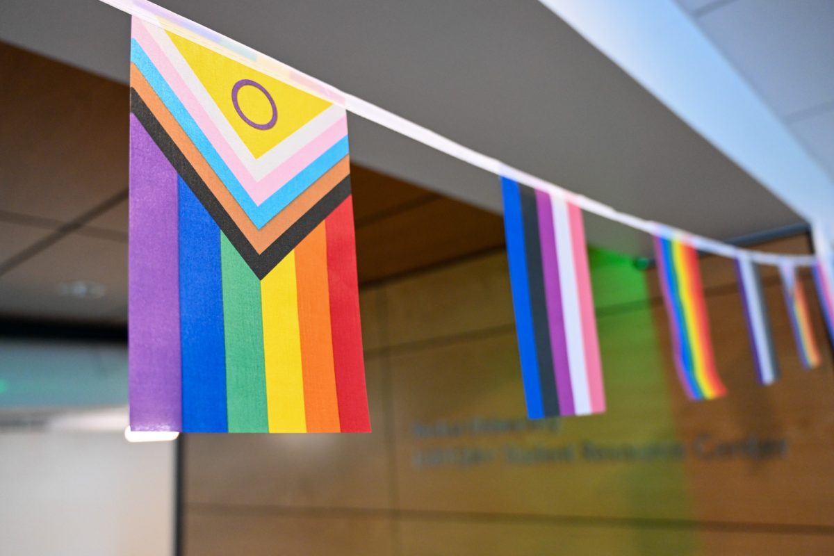 A string of pride flags in the LGBTQIA+ Resource Center in the Howard Thurman Center for Common Ground. Boston University faculty have been asked to remove public-facing pride flags in recent weeks.