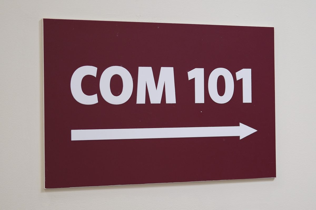 Sign for Boston University’s College of Communications’ COM CO 101 classroom. COM 101 is a required, introductory course for all COM students and features mass communications, public relations and journalism sections. 
