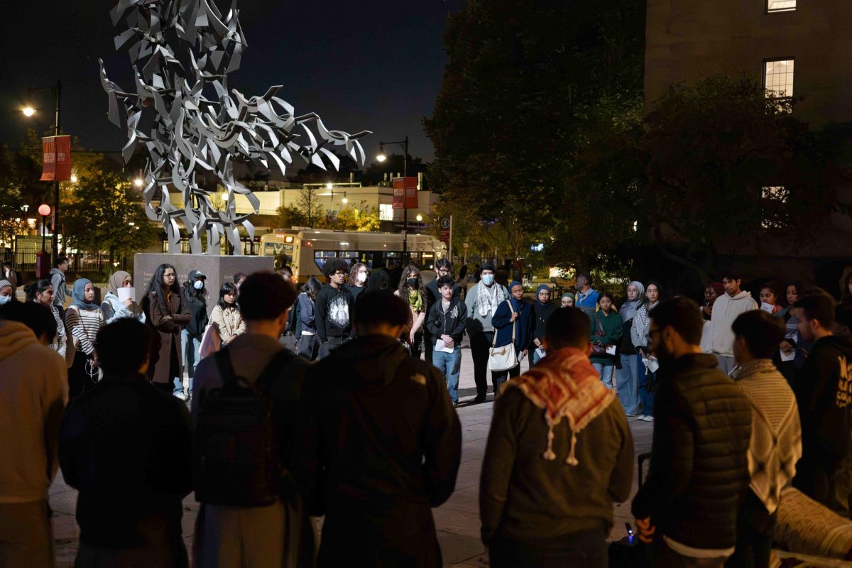 Students gather at Marsh Plaza to mourn the Palestinians who lost their lives in the Israel-Hamas War. The vigil was held on Wednesday and was hosted by several Boston University groups including the BU Palestine Student Association.  