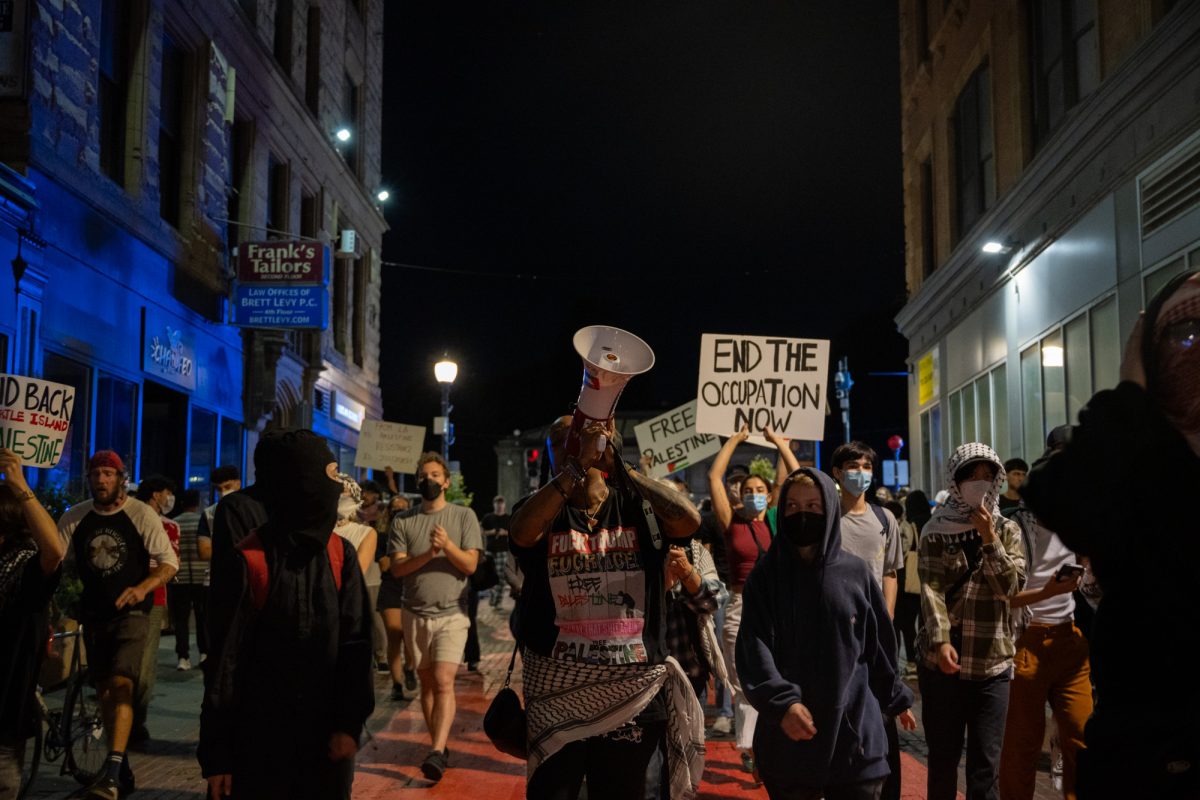 Protesters make their way down Winter Street toward Downtown Crossing after breaking through police lines. 