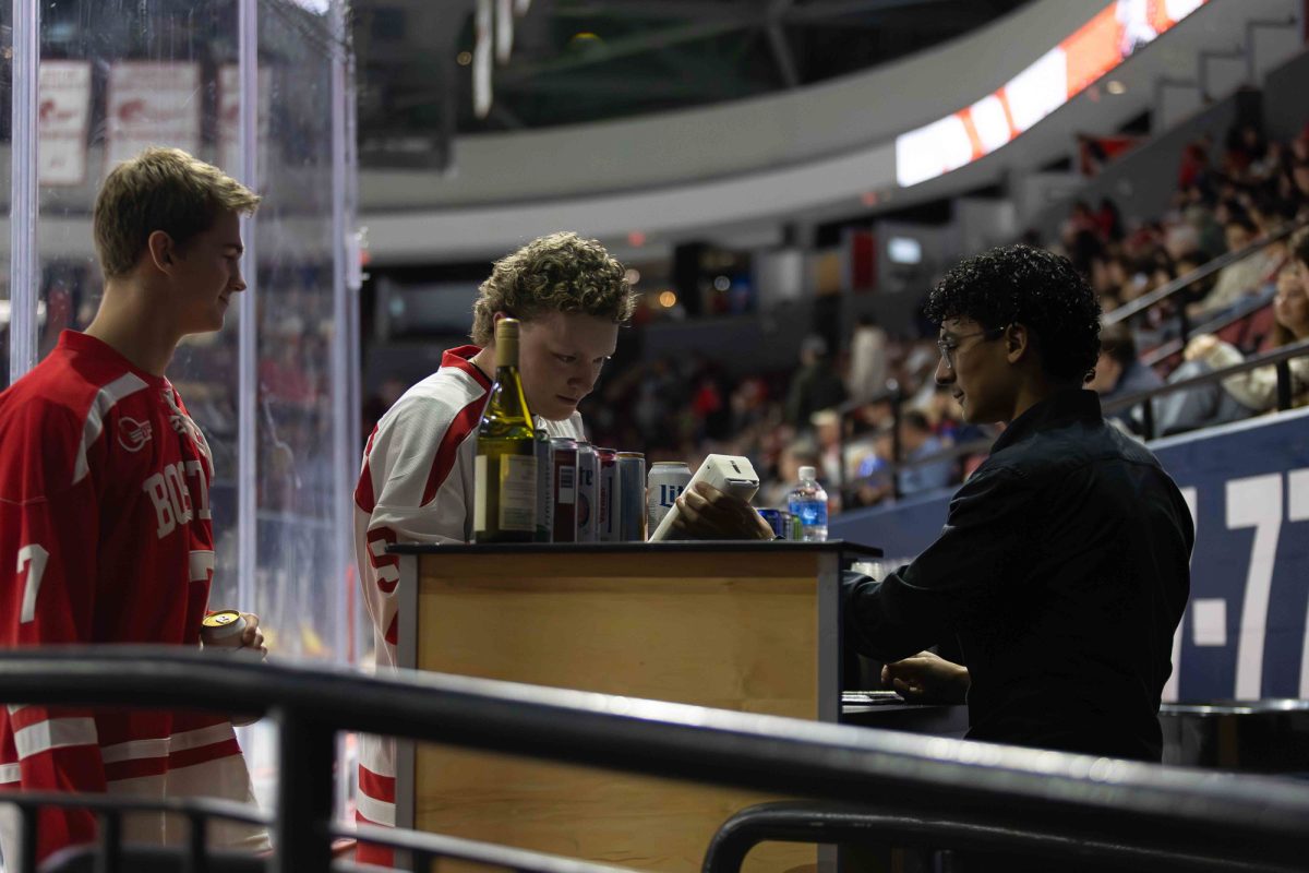 Sophomore Arlex Villatoro, Agganis Arena employee, at the Boston University’s men's hockey game on Oct. 10. Agganis Arena is home to the Boston Terriers, but also functions as a concert venue.