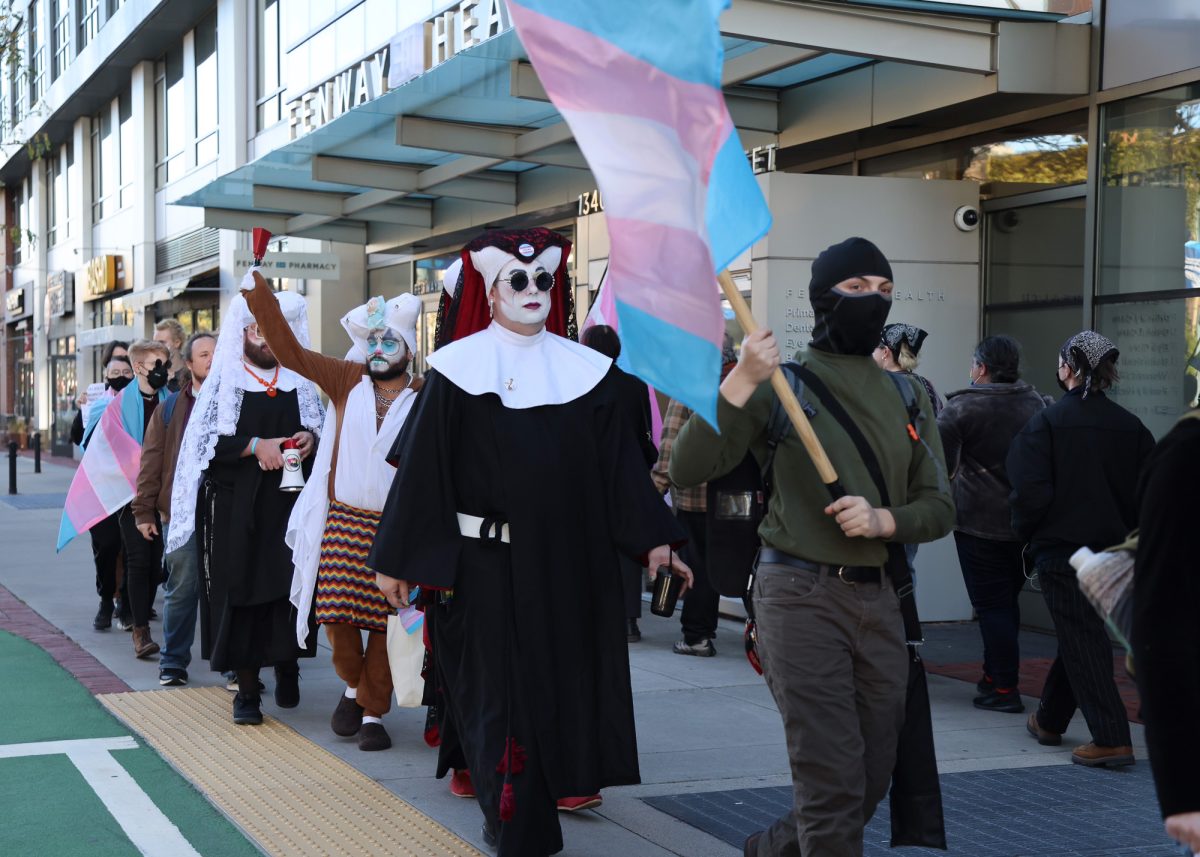 Protesters at the Fenway Health Medical Center on Boylston Street. The center has halted gender-affirming care for patients under 19 after facing federal backlash. 