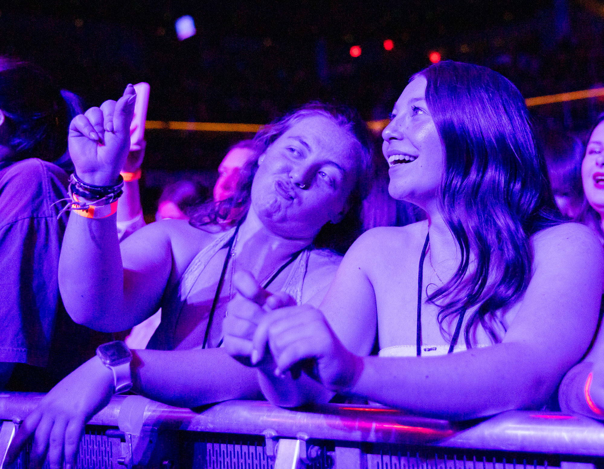 A fan does the "clock it" hand sign at the almost monday concert.