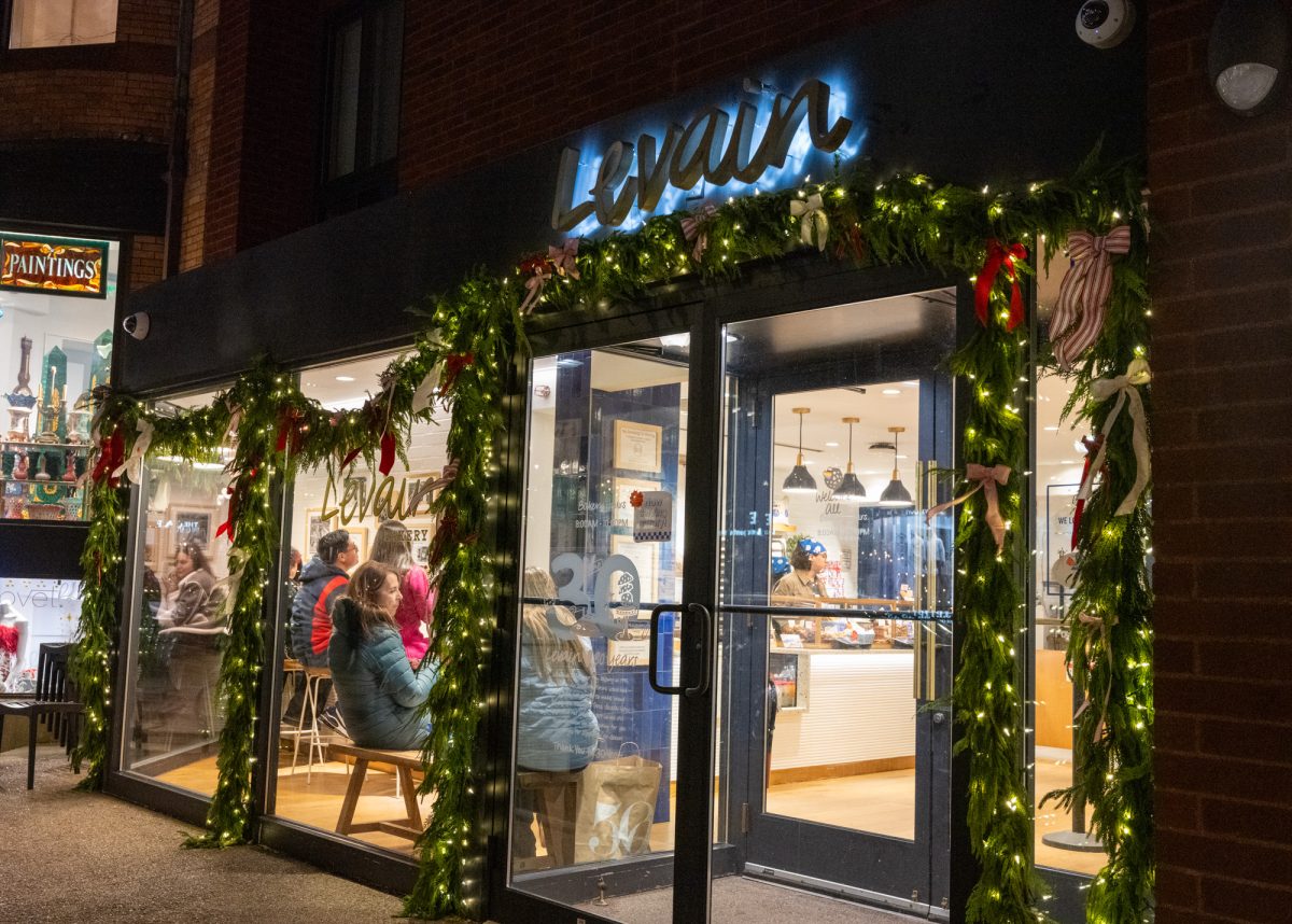 Levain Bakery, a popular pastry hot spot, adorns its door and windows with holiday decor. 