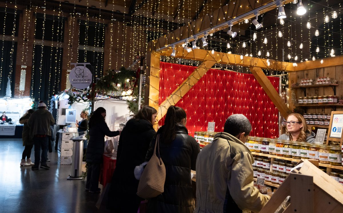 Customers check out products by Olde Haven Farm and SRL Chocolatiers. 