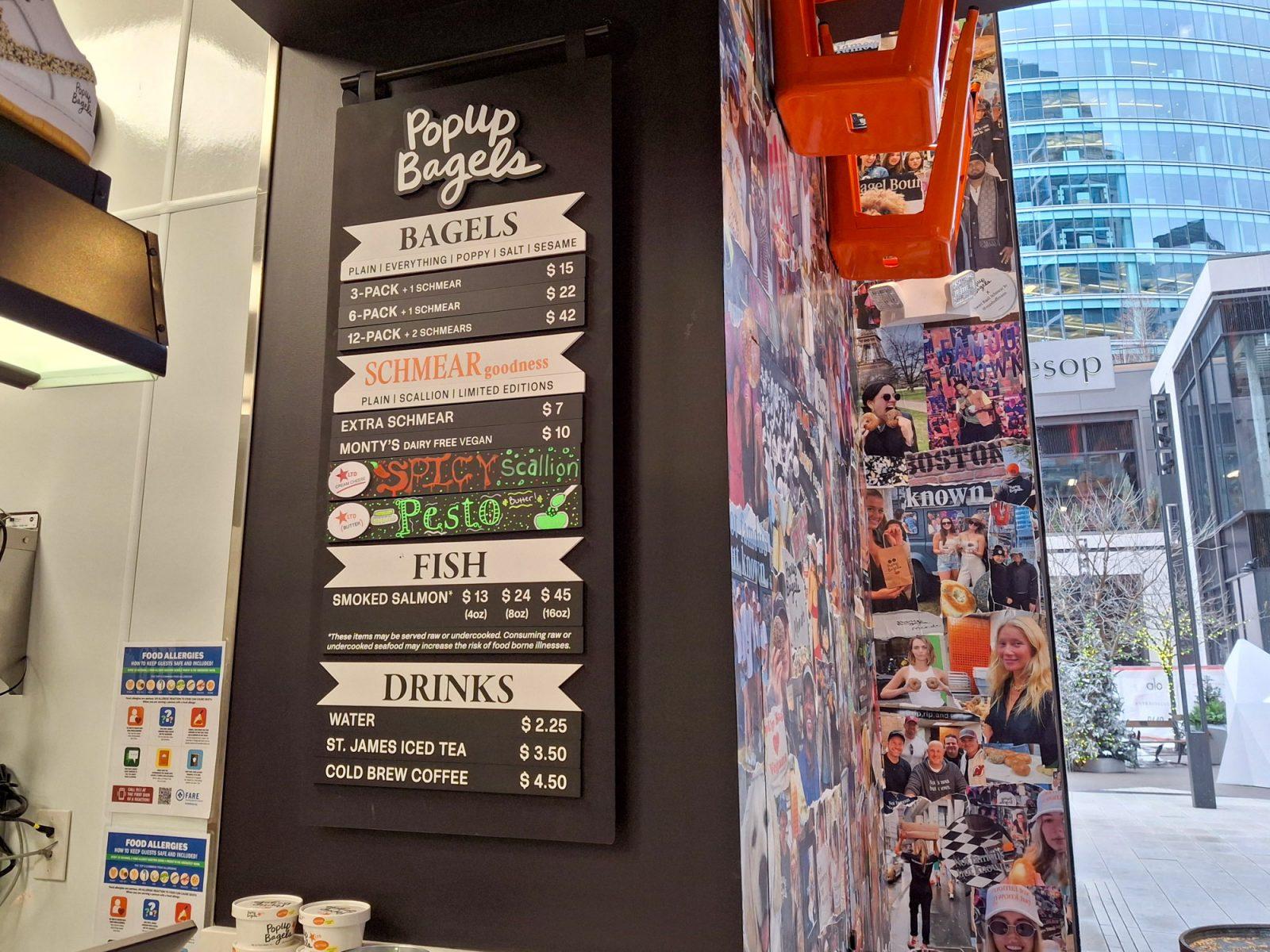 The menu at PopUp Bagels in Seaport. The bagel chain is known for selling uncut bagels that are meant to be ripped apart and dipped into cream cheese. PHOTO BY PAISLEY HUANG
