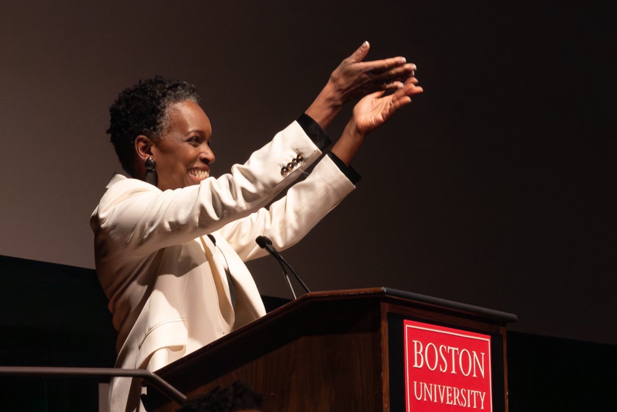 BU President Melissa Gilliam encourages audience members to stand for applause. Gilliam spoke on the university’s future as a leader in convergent research in her presidential address on Wednesday.