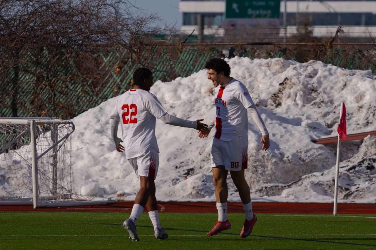Sophomore forward Dylan Williams (22) celebrates a goal scored by junior forward Andrea Di Blasio (7) in an exhibition match on March 1. With a new young team after the departure of 11 seniors, the BU men’s soccer team is currently preparing for the inaugural Northeast Spring Cup.
