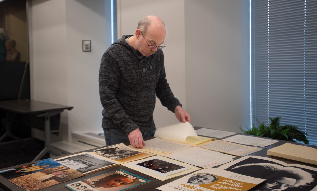 Processing archivist J.C. Johnson sorts through the Gotlieb Center’s Giovanni collection.