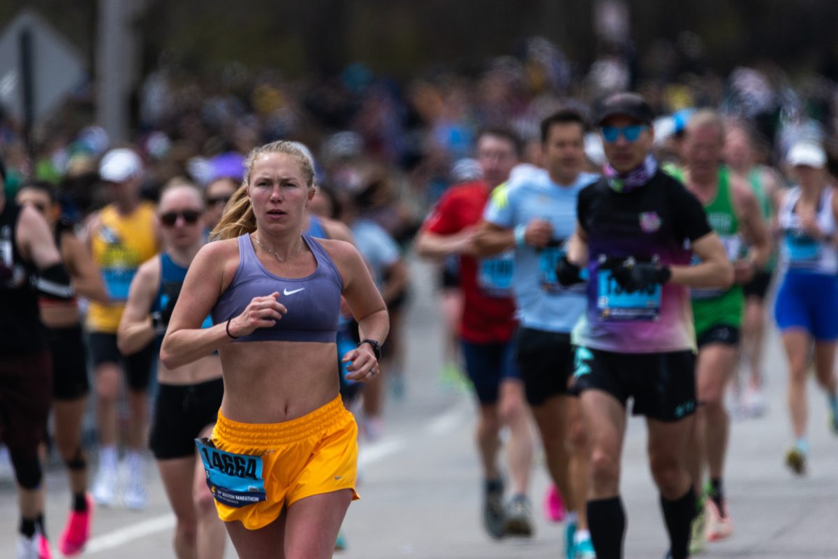 Tara Johnson of Colorado runs the 2026 Boston Marathon. The Newbury Street Nike Store removed an advertisement in their windows that read “Runners welcome. Walkers tolerated” after receiving backlash.
