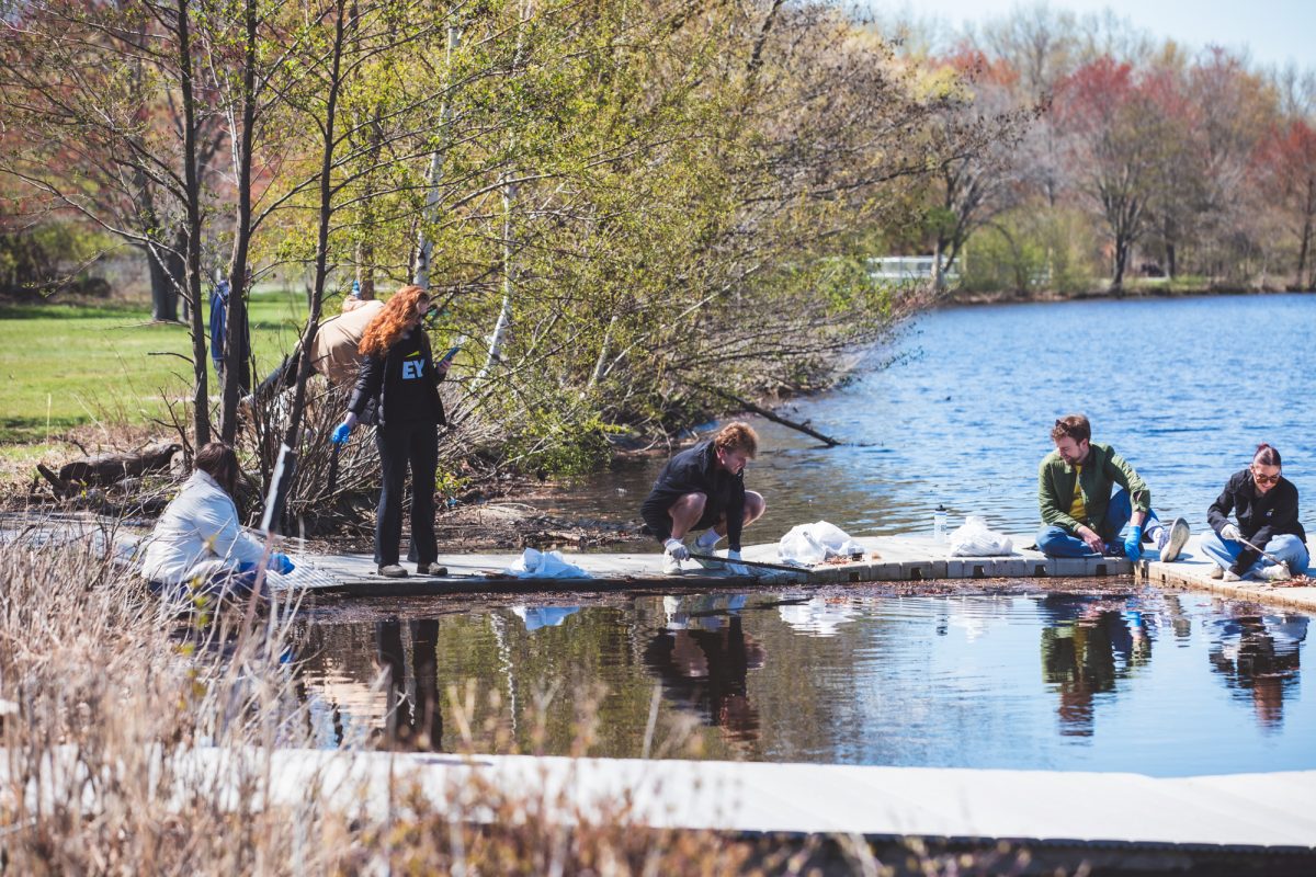 Volunteers pick trash out of the Charles River. Several local conservation organizations teamed up for the 27th annual Charles River Cleanup April 24-25.