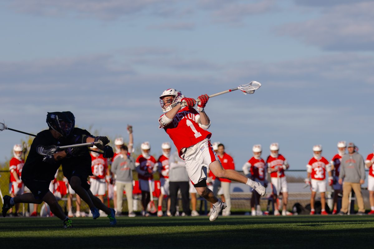 Sophomore attack Timothy Shannehan (1) shoots the ball. Shannehan finished with seven points as BU men’s lacrosse closed out the regular season with an 18-12 win over the Holy Cross Crusaders.