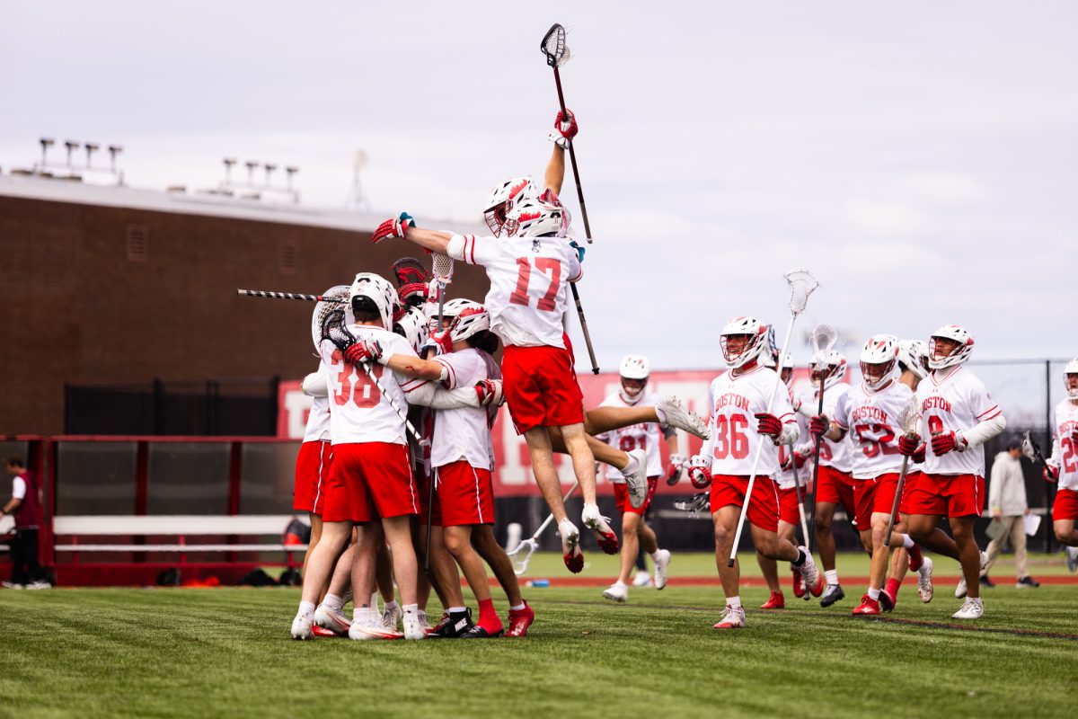 The Terriers celebrate after their win. On senior day, BU men’s lacrosse pummeled the Lafayette College Leopards in a 13-2 win.