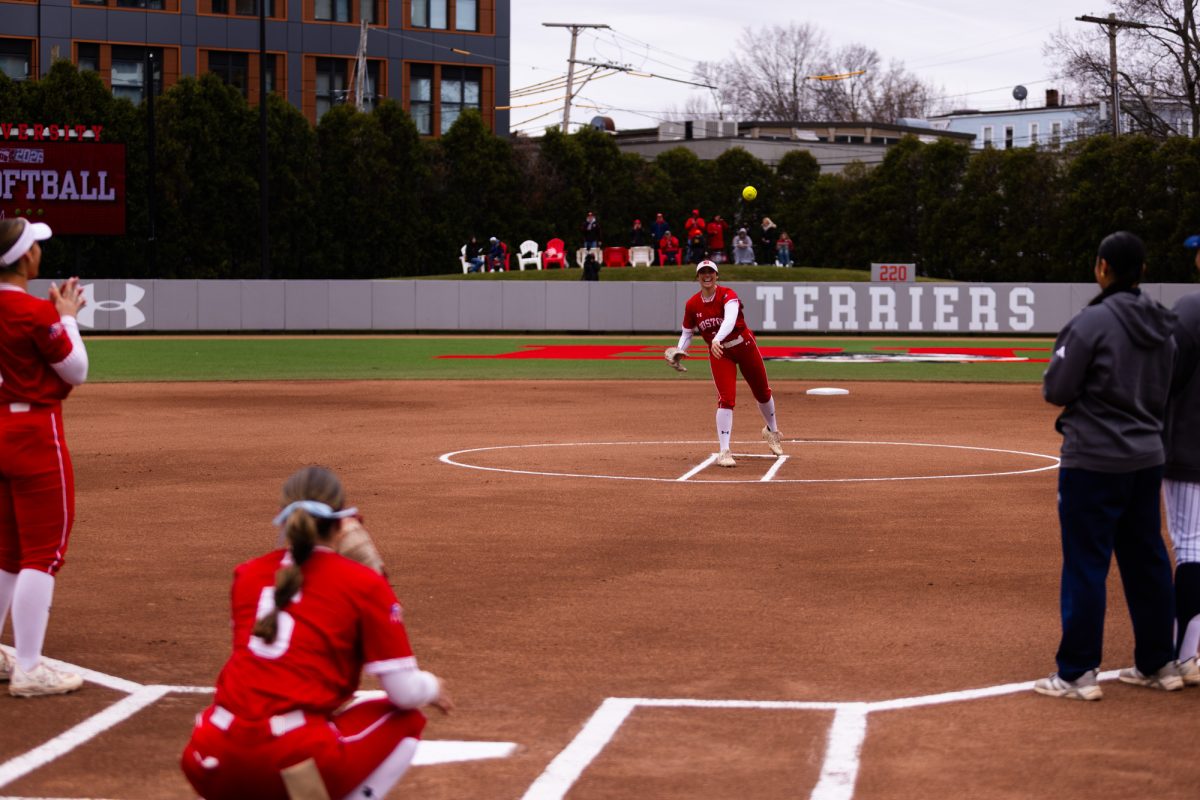 Sophomore pitcher Ava Johnson (24) throws the ceremonial first pitch. The BU softball team swept the Bucknell University Bisons with their third run-rule victory, scoring 15 runs in the series finale.