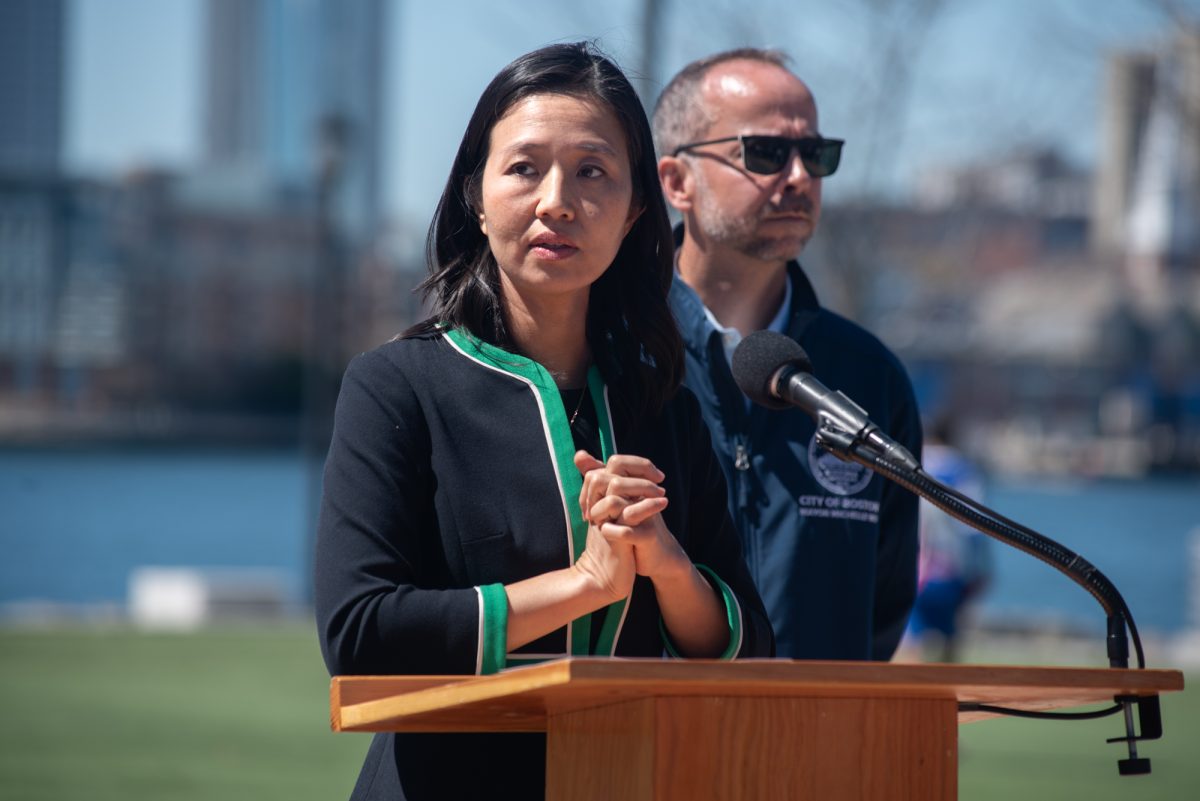 Boston Mayor Michelle Wu, backed by the city’s first chief climate officer, Brian Swett, answers an audience question following her announcement of the 2030 Climate Action Plan at LoPresti Park in East Boston. The initiative aims to fight climate change by reducing community greenhouse emissions by 50% by 2030.
