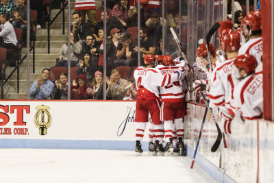 BU players celebrate a goal in the team's 5-4 win over Northeastern. PHOTO BY JUSTIN HAWK/DAILY FREE PRESS STAFF 