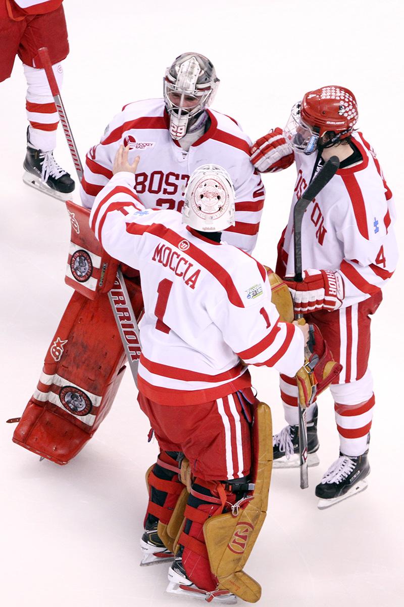 Anthony Moccia skates over to Matt O'Connor after BU's championship game loss to Providence College. PHOTO BY MAYA DEVEREAUX/DAILY FREE PRESS STAFF