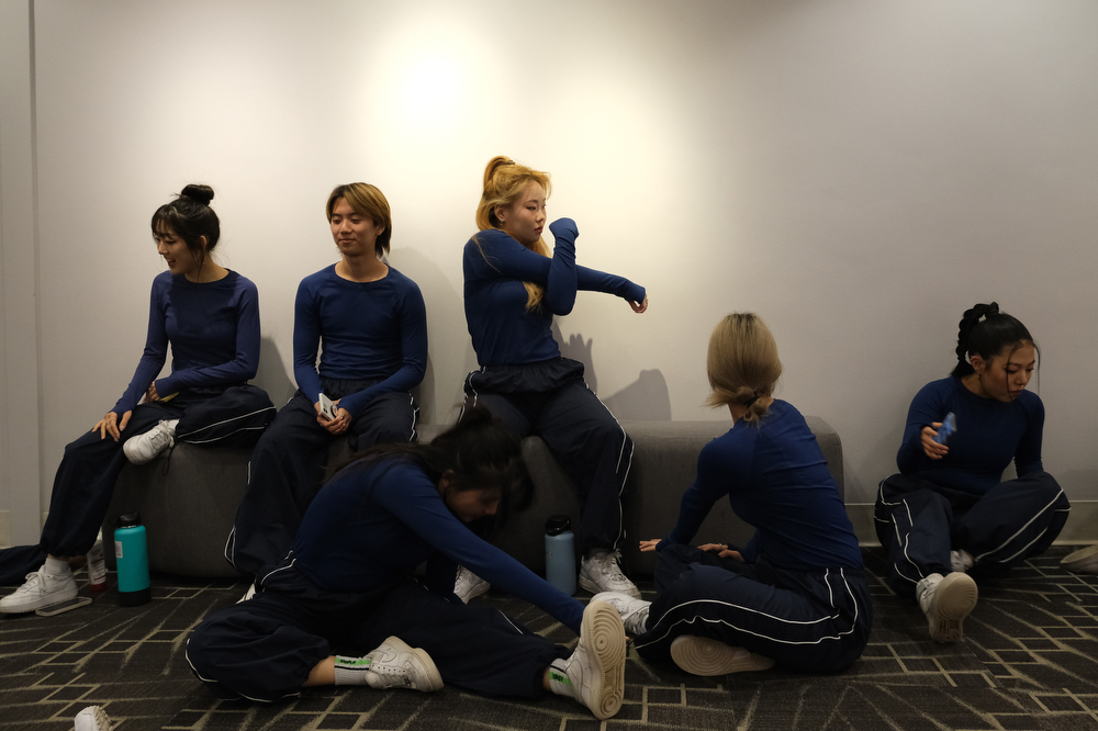 Dance troupe BU Fusion warms up in the hallway before the show starts.
