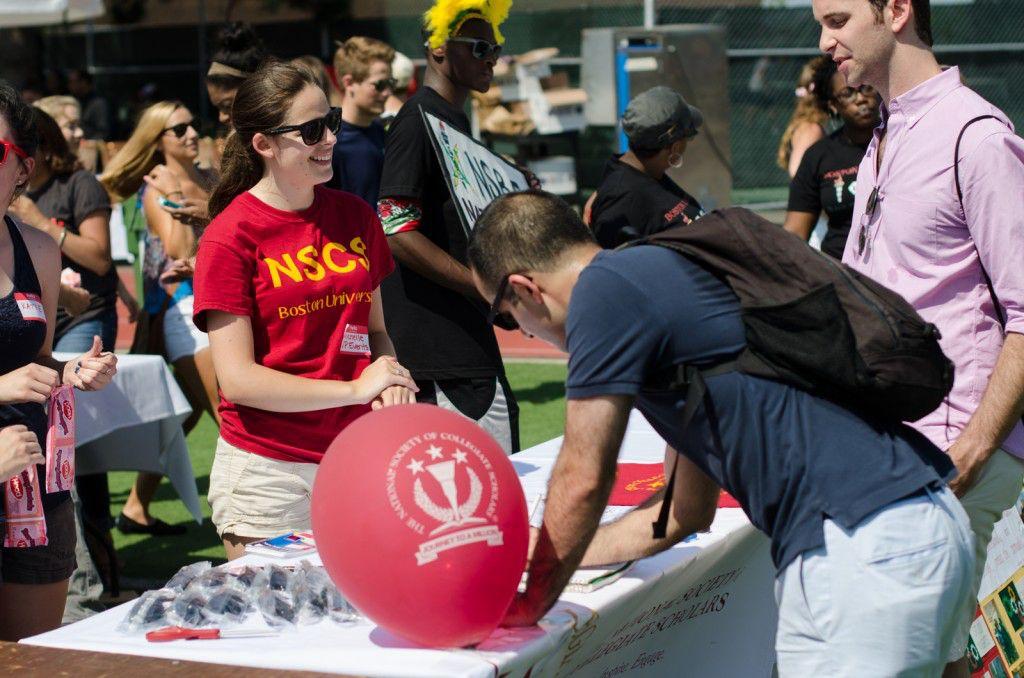 Students at the National Society of Collegiate Scholars table at SPLASH in 2014. On Wednesday, the Student Activities Office at Boston University released guidelines restricting student organizations to holding most meetings virtually in the Fall. MIKE DESOCIO/DFP FILE