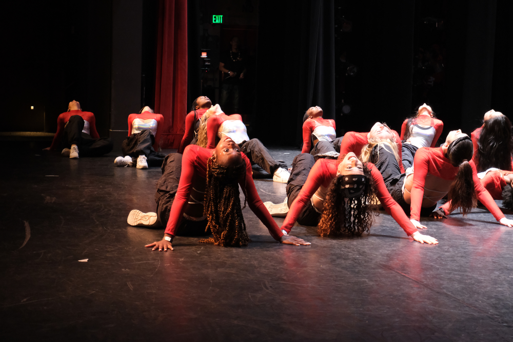 BU Vibes leans back during their performance.