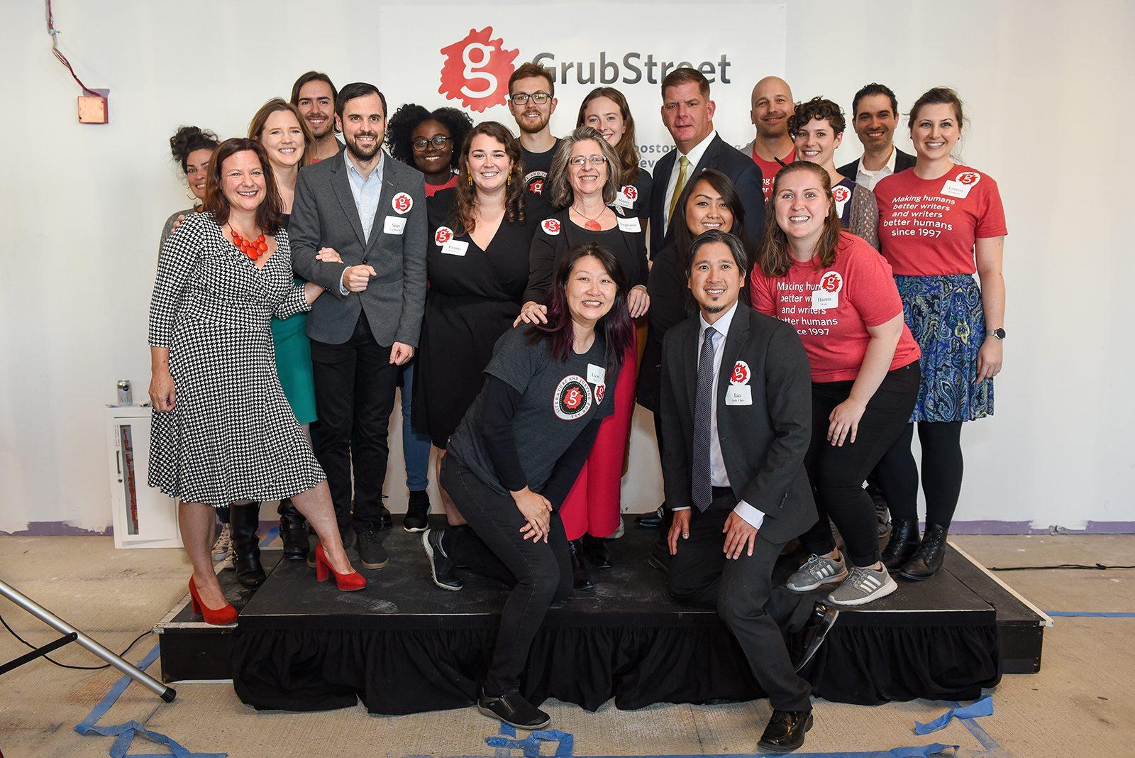 Boston Mayor Martin Walsh and GrubStreet staff pose for a photo at the construction kickoff event held last Friday for GrubStreet’s upcoming cultural center in the Seaport District. COURTESY OF THE CITY OF BOSTON