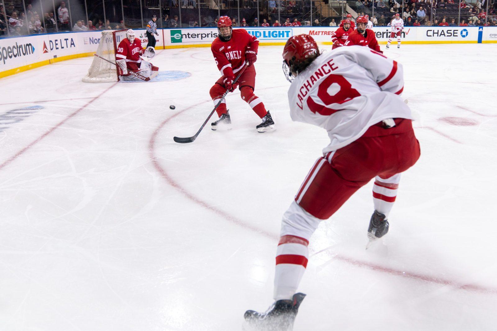 Freshman forward Shane Lachance (18) puts a shot on net against Cornell University. HUI-EN LIN/DFP PHOTOGRAPHER