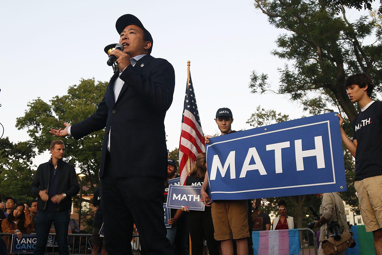 Presidential candidate Andrew Yang speaks to a crowd of his supporters, dubbed “The Yang Gang,” at a rally held in the Cambridge Common on Monday evening. GABRIELA HUTCHINGS/ DAILY FREE PRESS STAFF