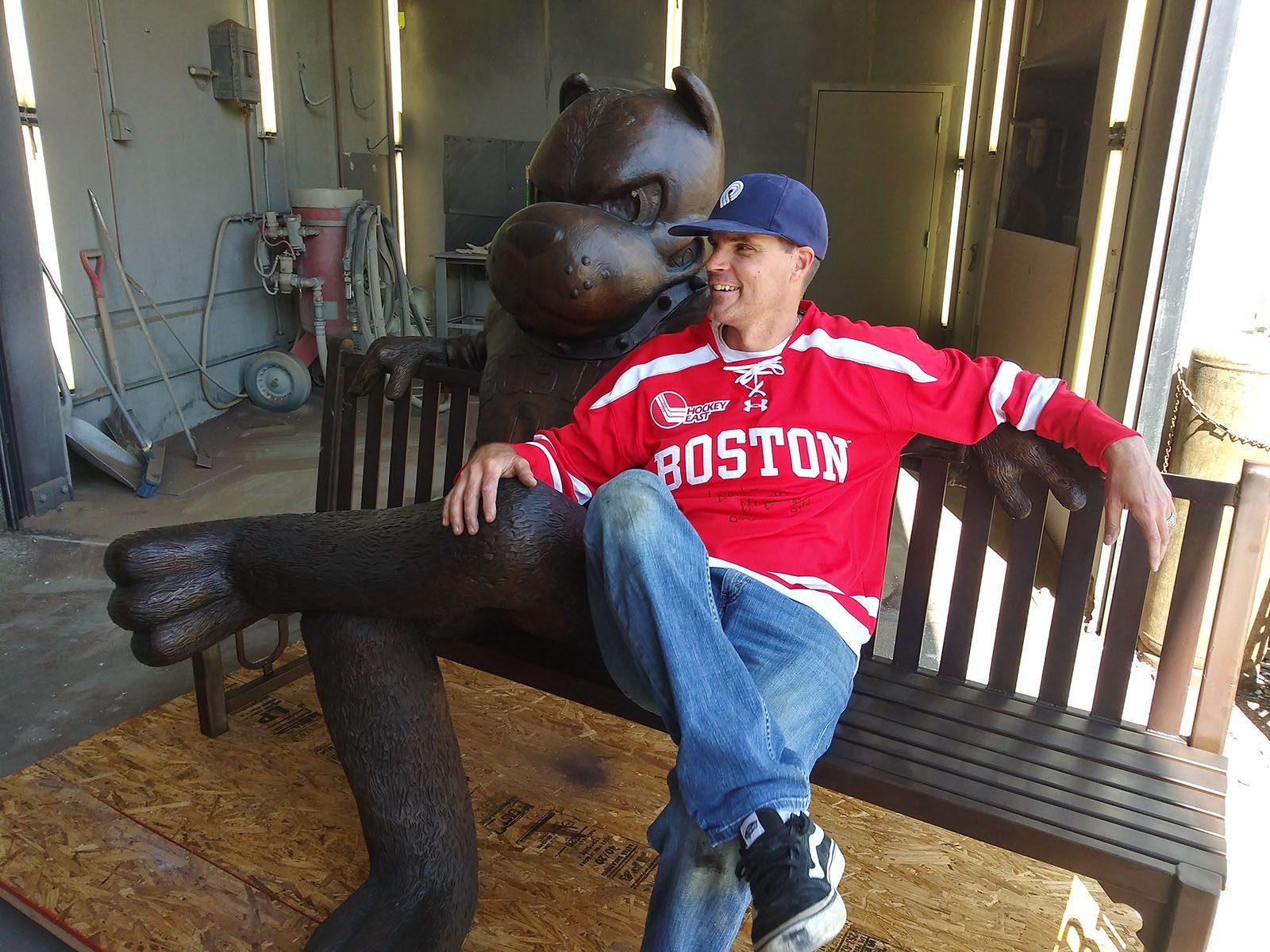 Virgil Oertle, the artist behind the Boston University’s new Rhett Bench located on the BU Beach, sits with his final creation in his workshop. COURTESY OF VIRGIL OERTLE