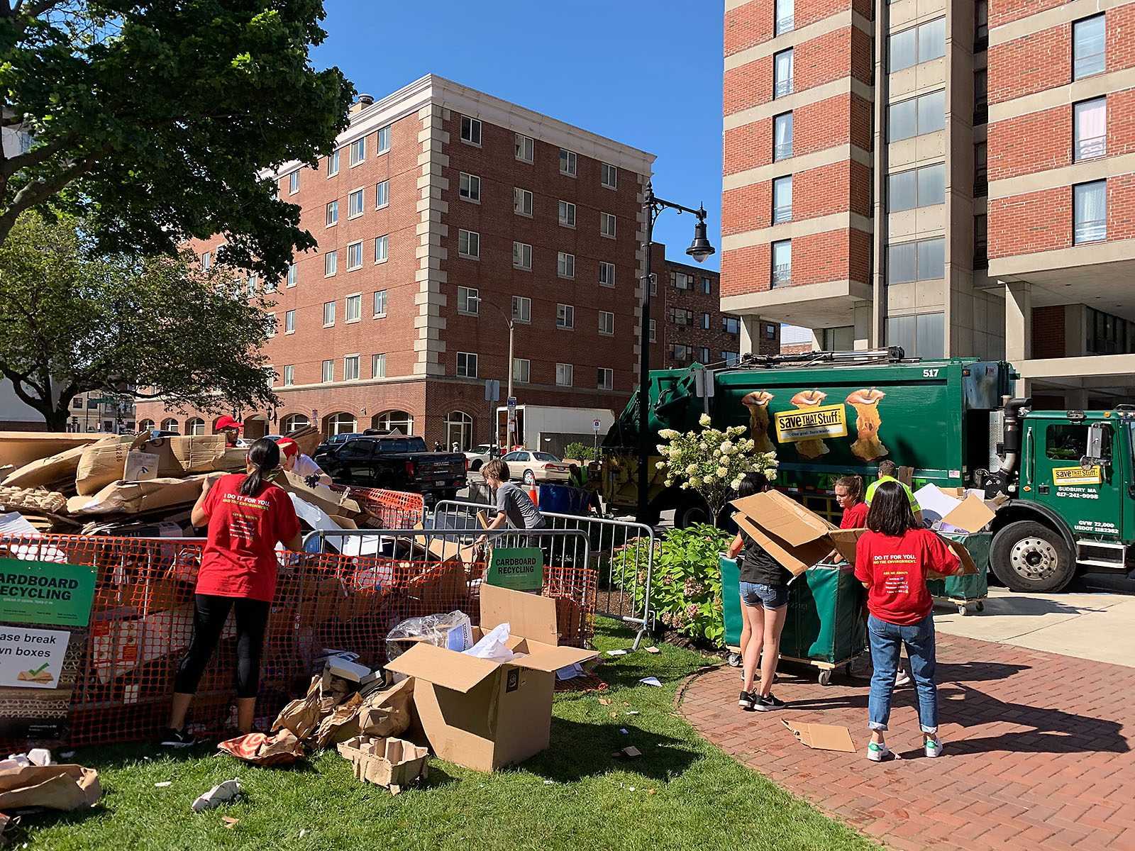 Students break down cardboard boxes for recycling on Babcock Street during move-in. Recycling posts were seen throughout campus as part of sustainability@BU’s cardboard recycling initiative at the start of September. COURTESY OF GABRIELA BOSCIO
