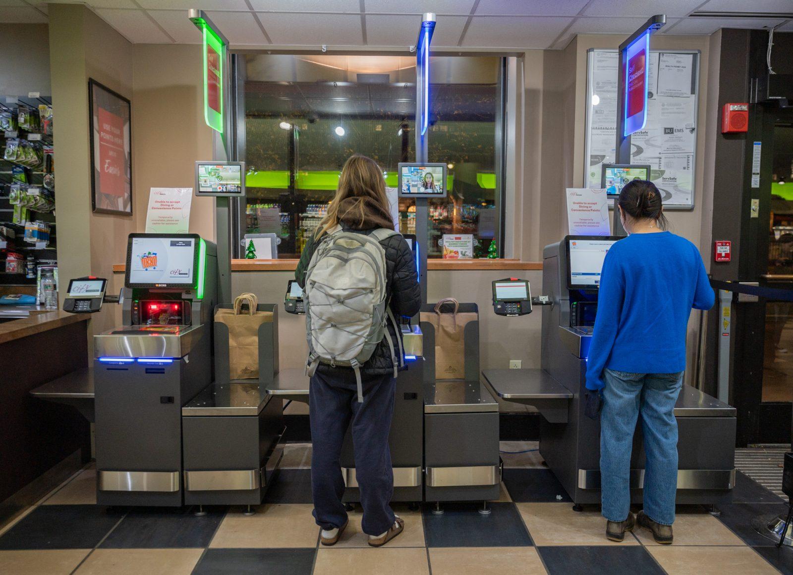 People using the new self-checkout machines in City Convenience at Warren Towers. The machines were installed to make the check-out process quicker and more convenient. KATE KOTLYAR/DFP PHOTOGRAPHER
