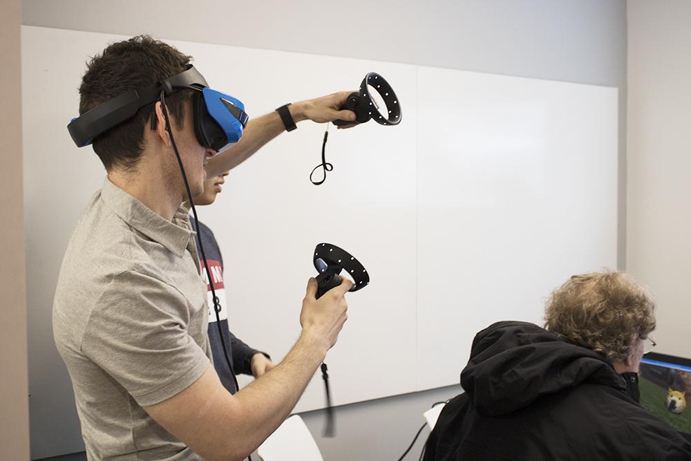 A student tests out an AR/VR project at the AR/VR festival on April 19. The event was meant to connect students and professionals through the BUild Lab. PHOTO BY JOHN LITTLE/DAILY FREE PRESS STAFF 
